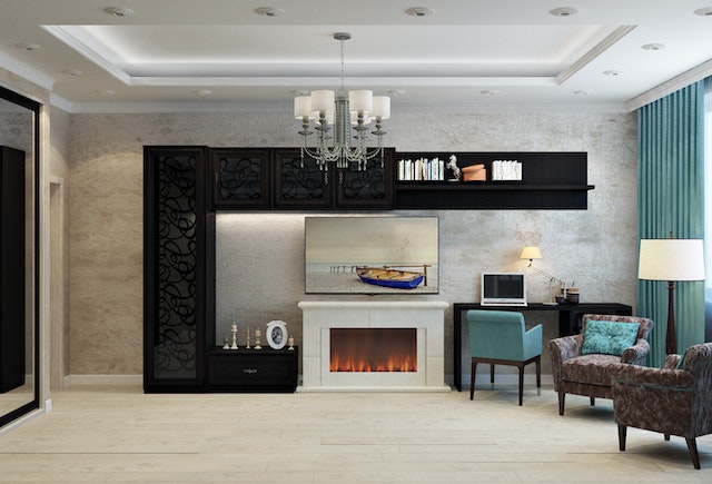 living room with fireplace and chairs